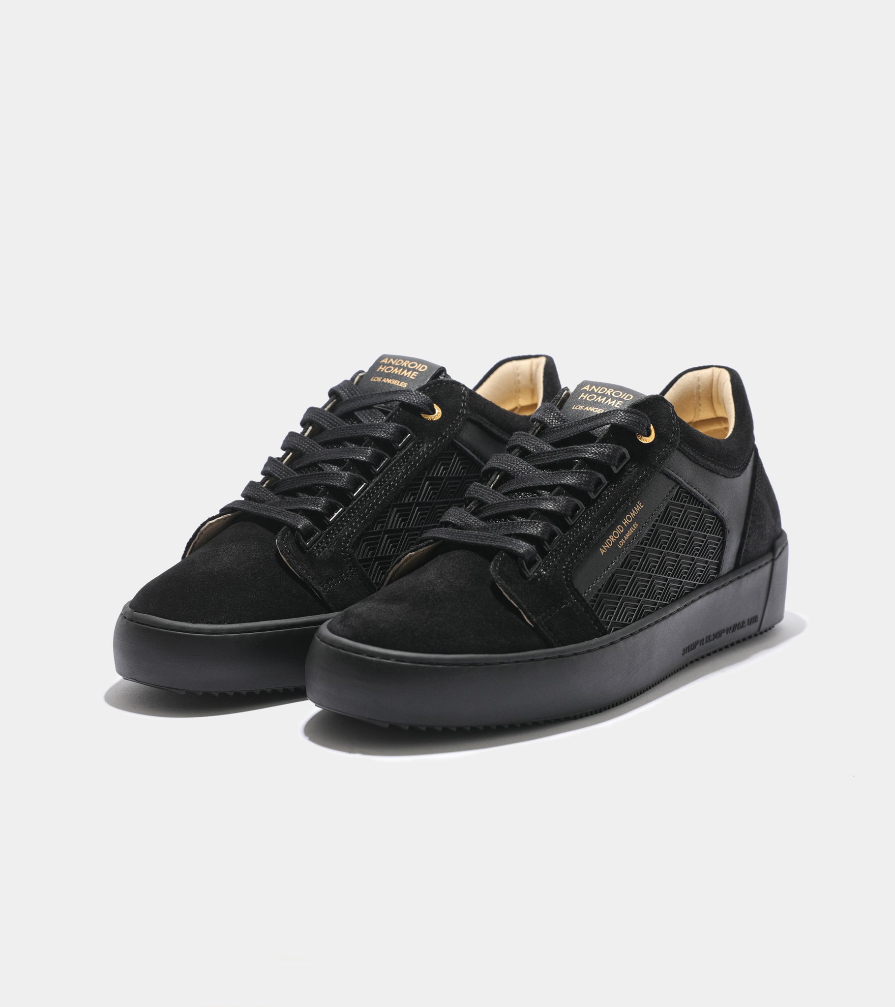 Detailed ecom imagery of the Venice Black Rubber Tipnet Android Homme Trainers with patterns.