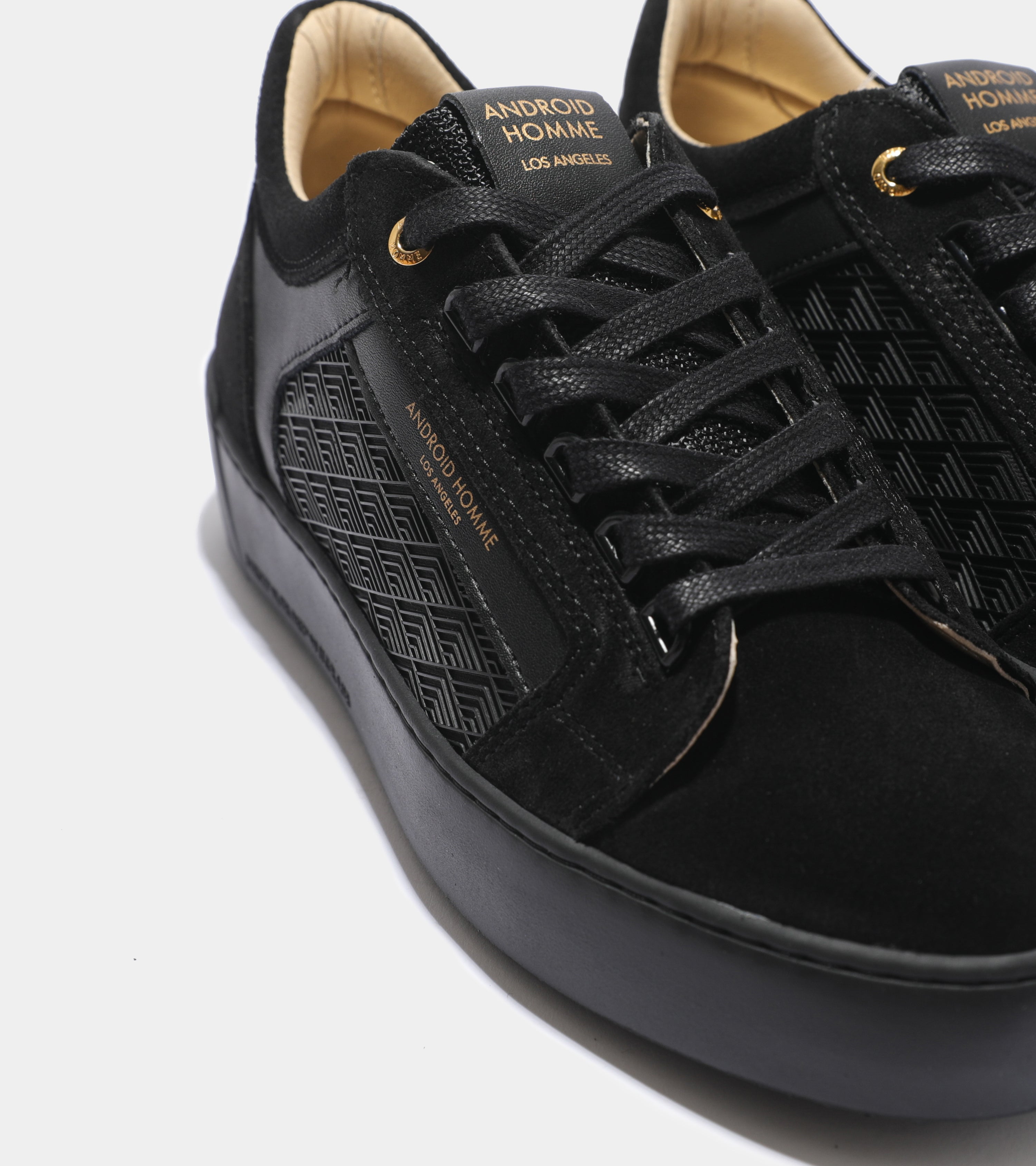 Detailed ecom imagery of the Venice Black Rubber Tipnet Android Homme Trainers with patterns.