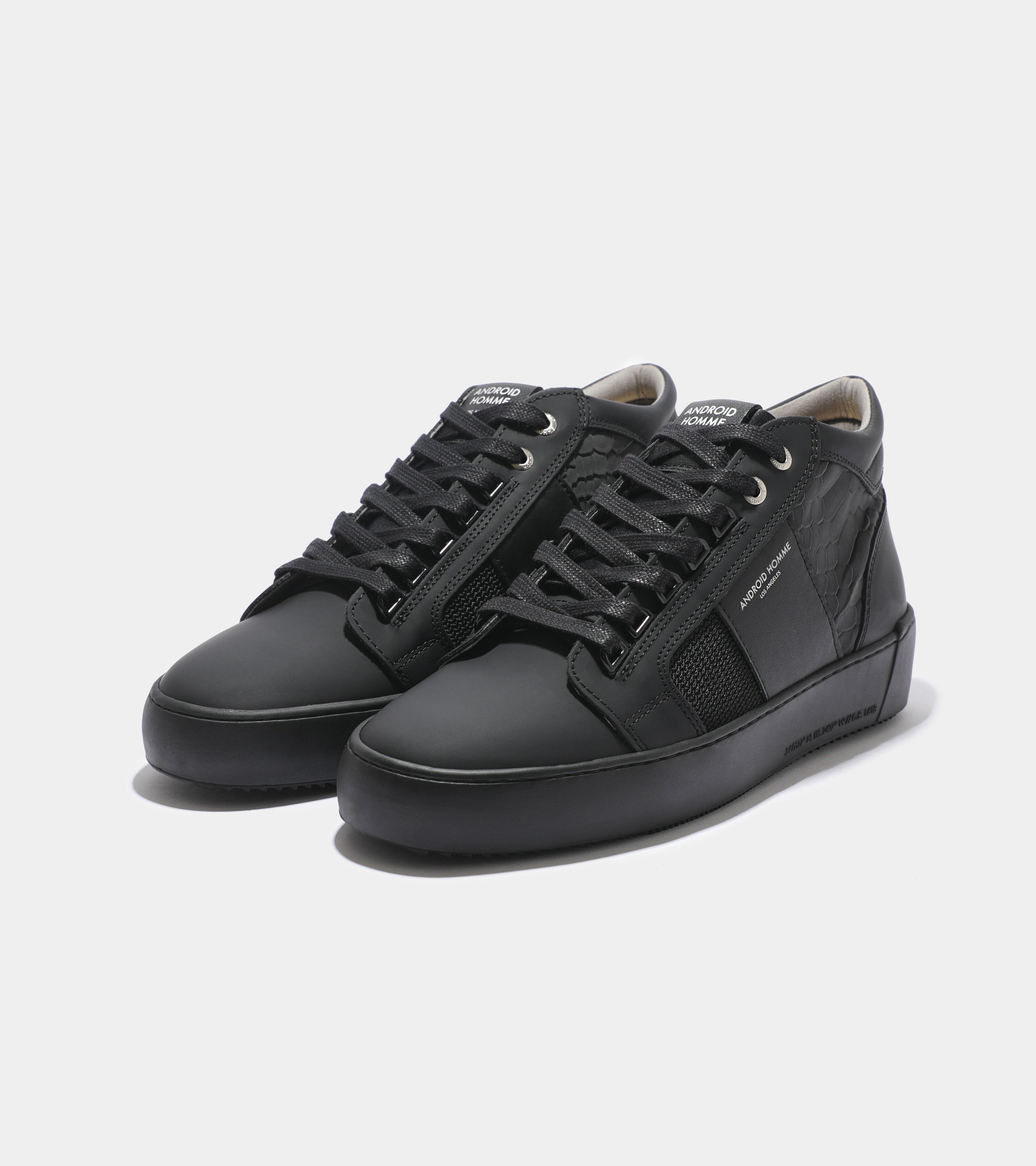 Ecom imagery of the Propulsion Mid Black Gomma Reflective Python Android Homme Trainers.