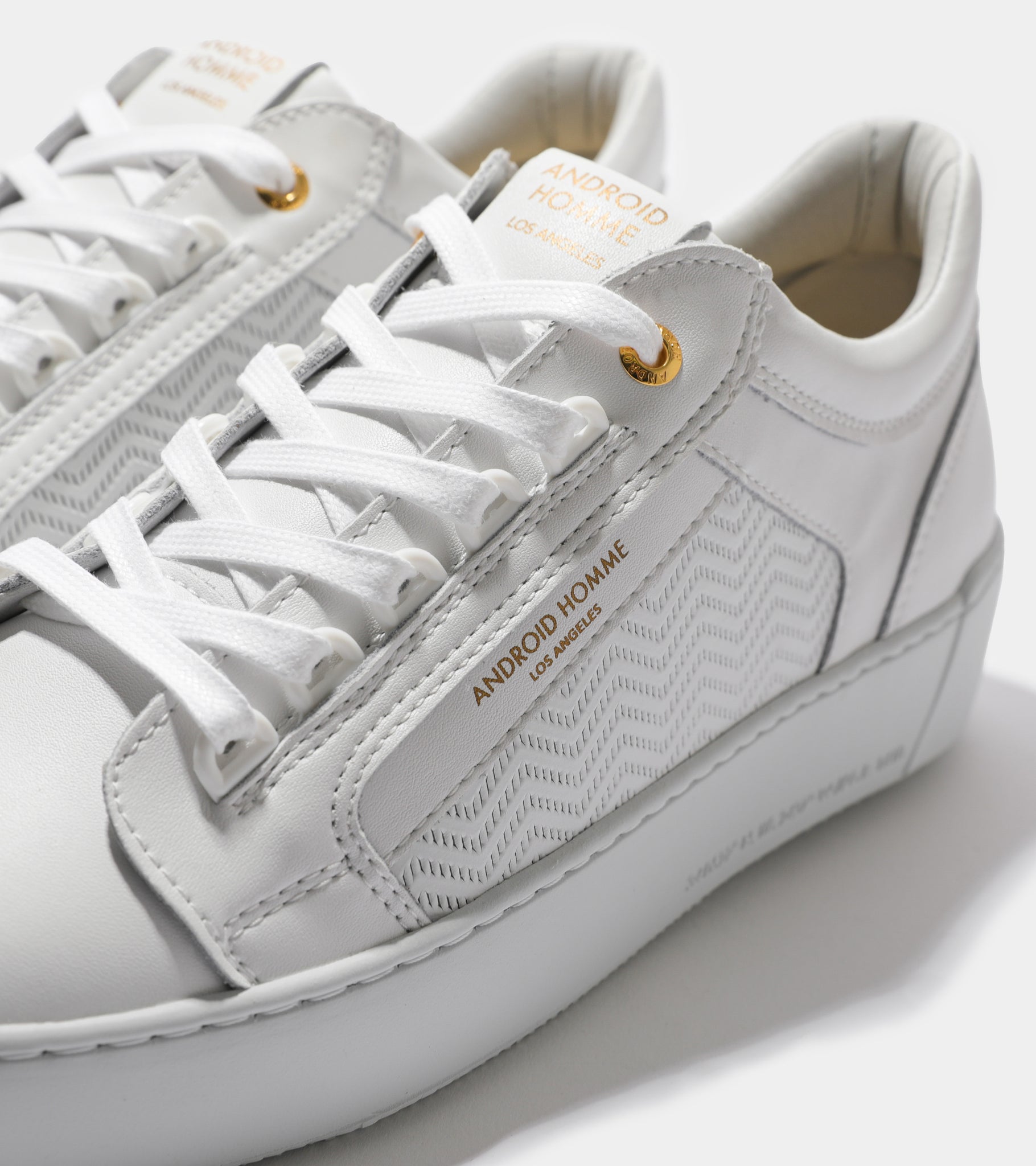Detailed ecom imagery of the Venice White Emboss Leather Android Homme Trainers.