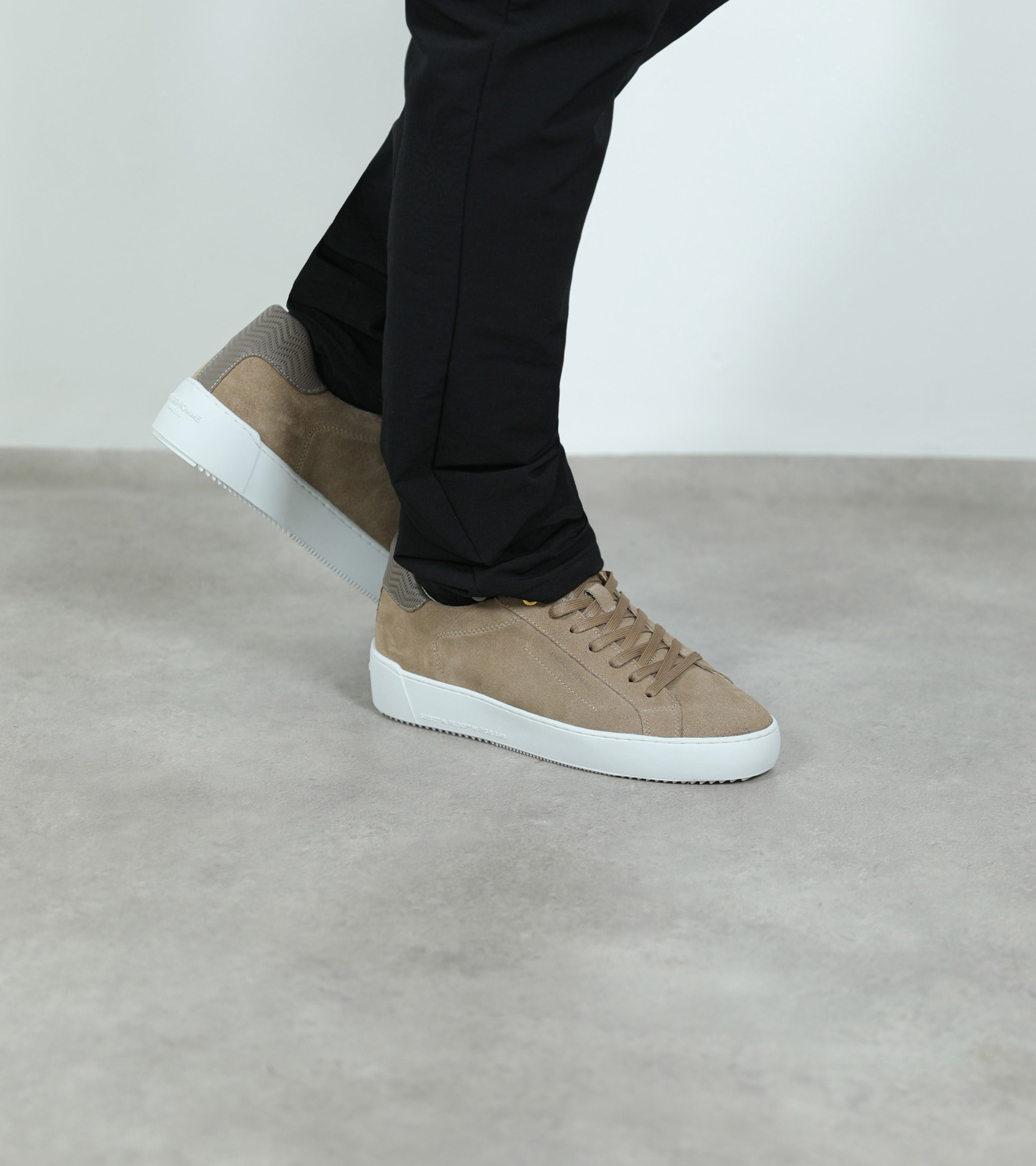 Ecom imagery of the Zuma Taupe Suede Zig Zag Leather Android Homme Trainers on foot.