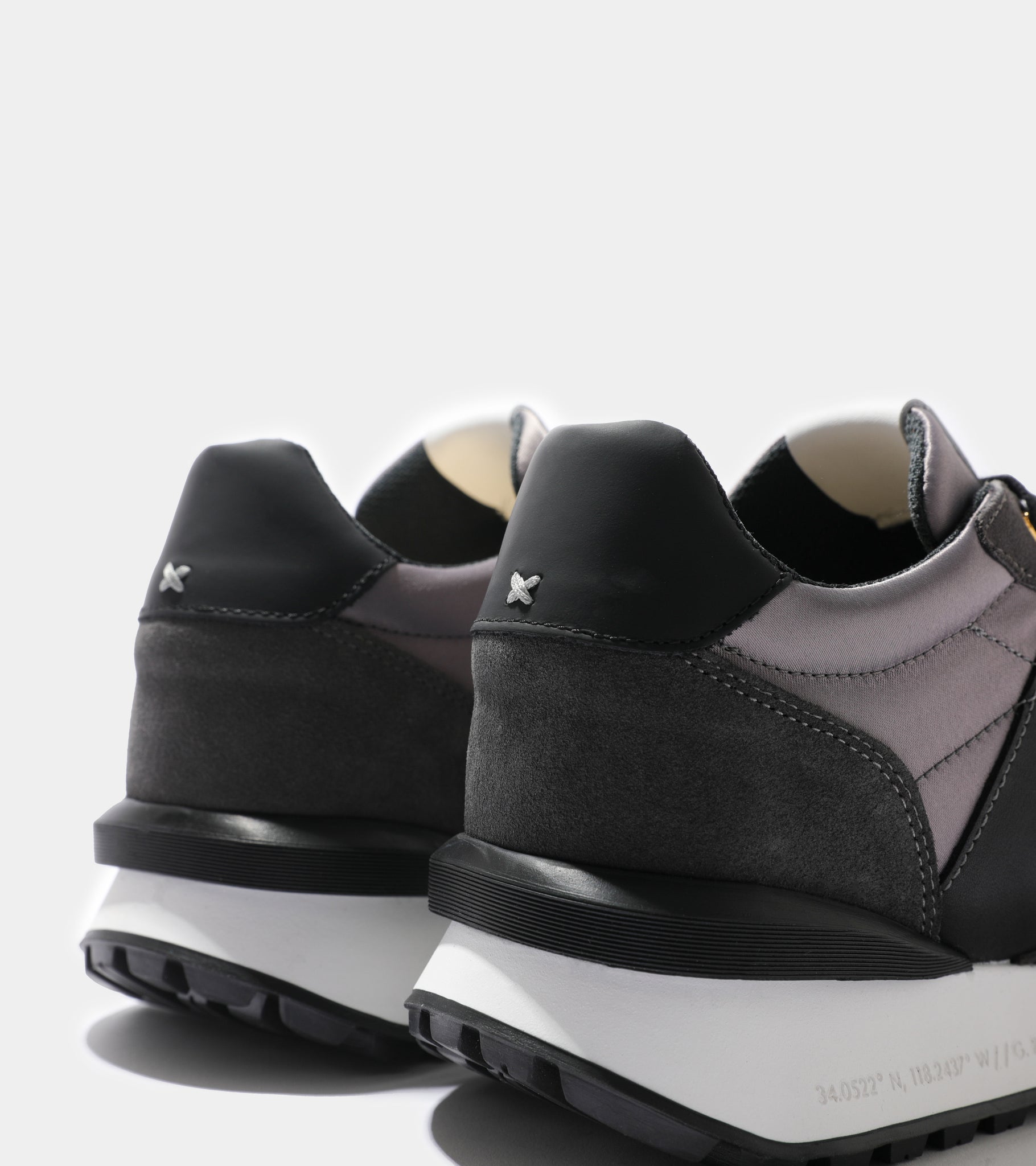 Detailed ecom imagery of the heel of the Marina Del Rey Grey Nylon Black Suede Android Homme Trainers.