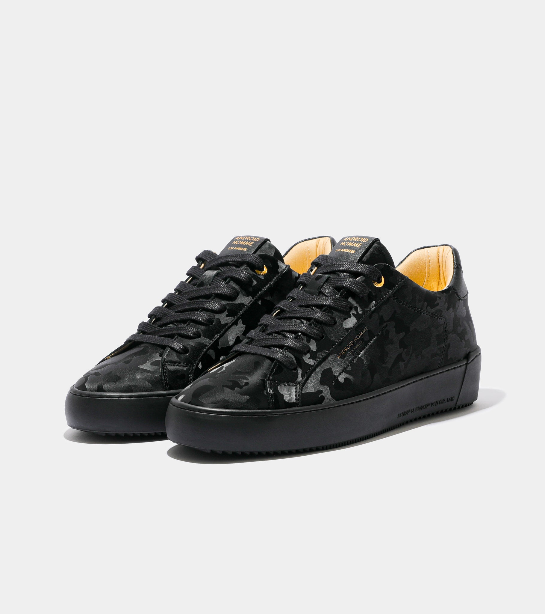 Ecom imagery of the Zuma All Over Black Leather Camo Android Homme Trainers.