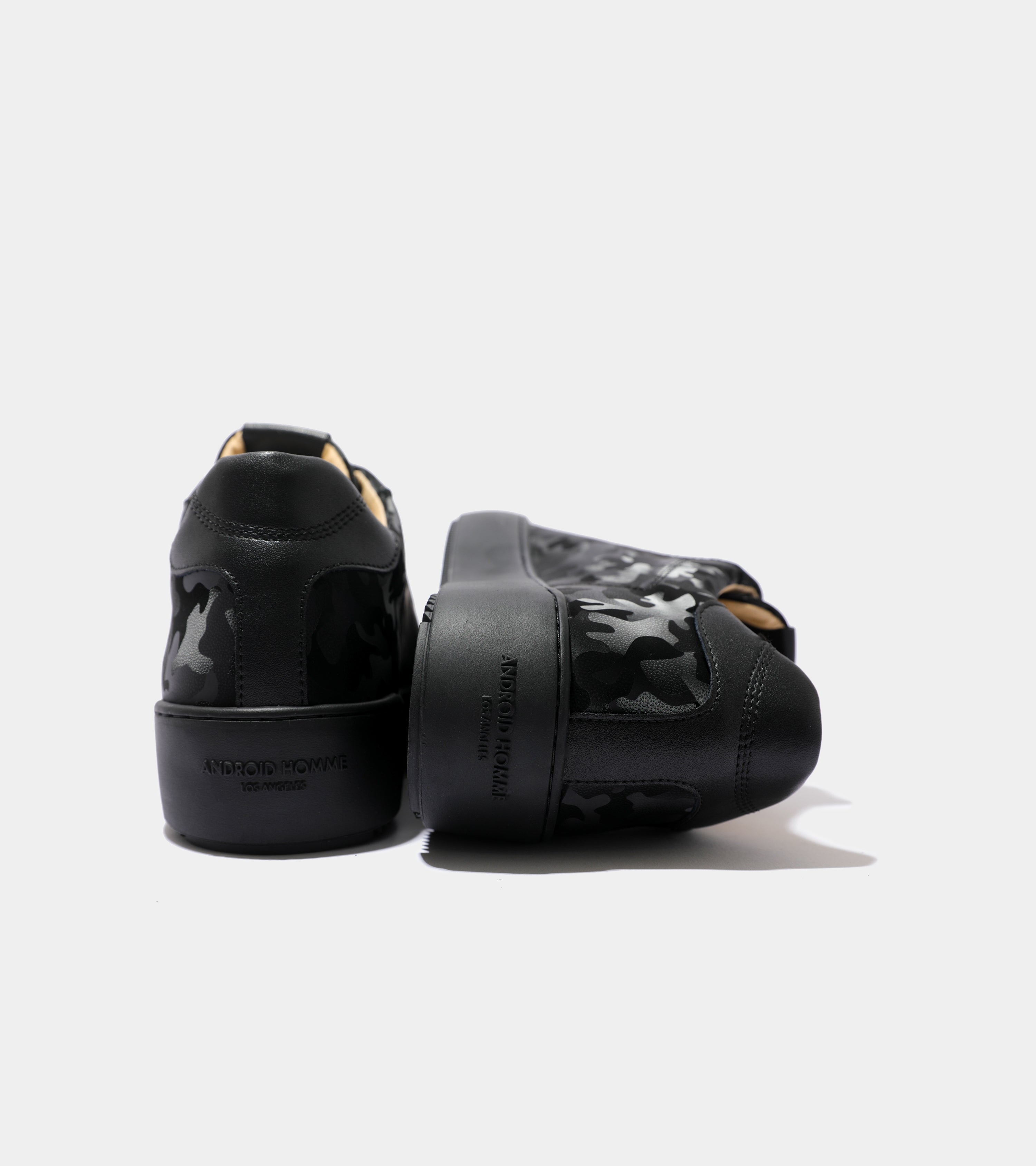 Ecom imagery of the Zuma All Over Black Leather Camo Android Homme Trainers.